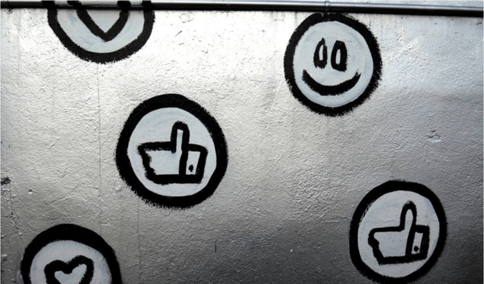 Thumbs up and smiley face symbols
